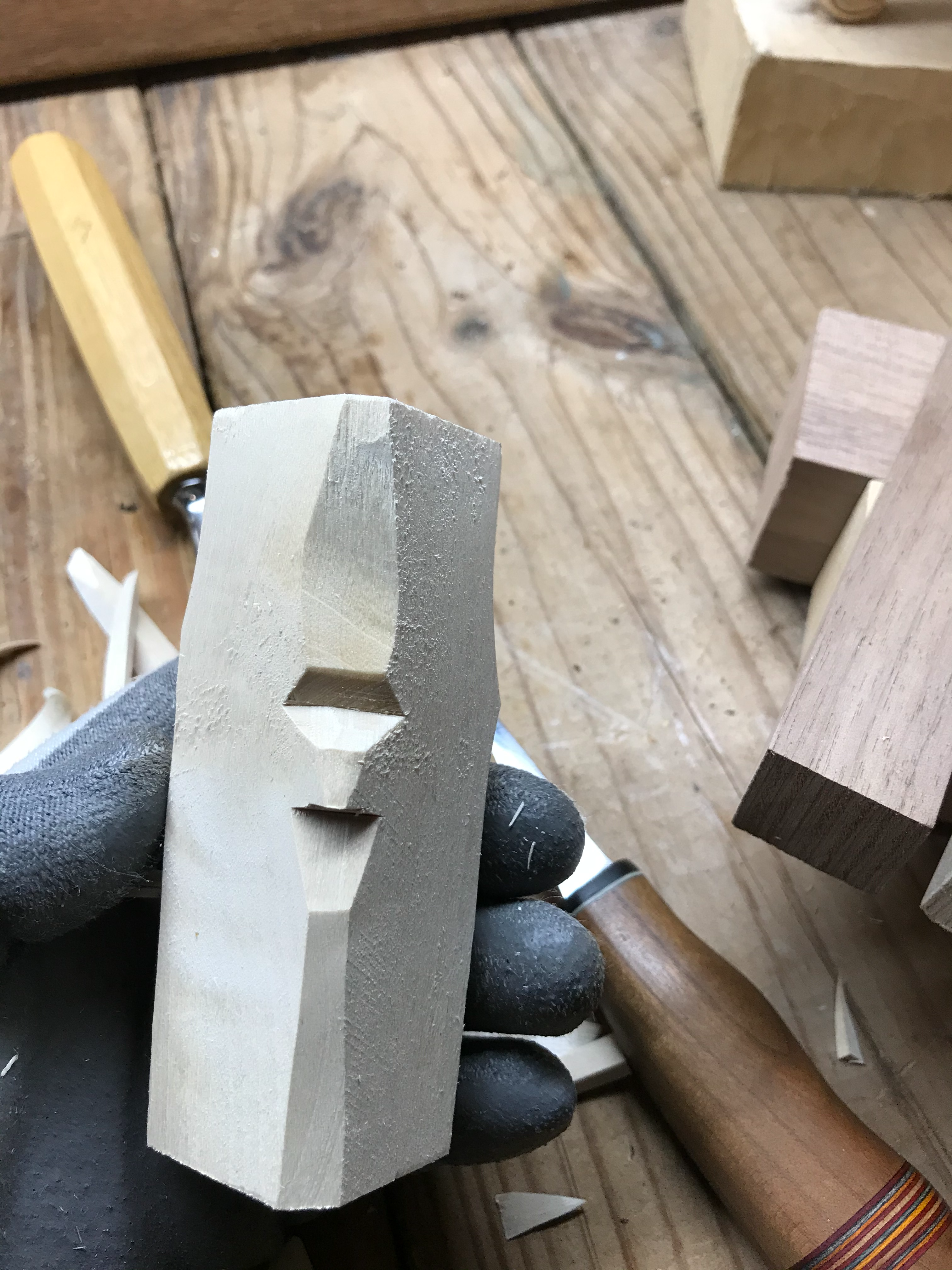 Wood carver using Basswood to carve sculpture