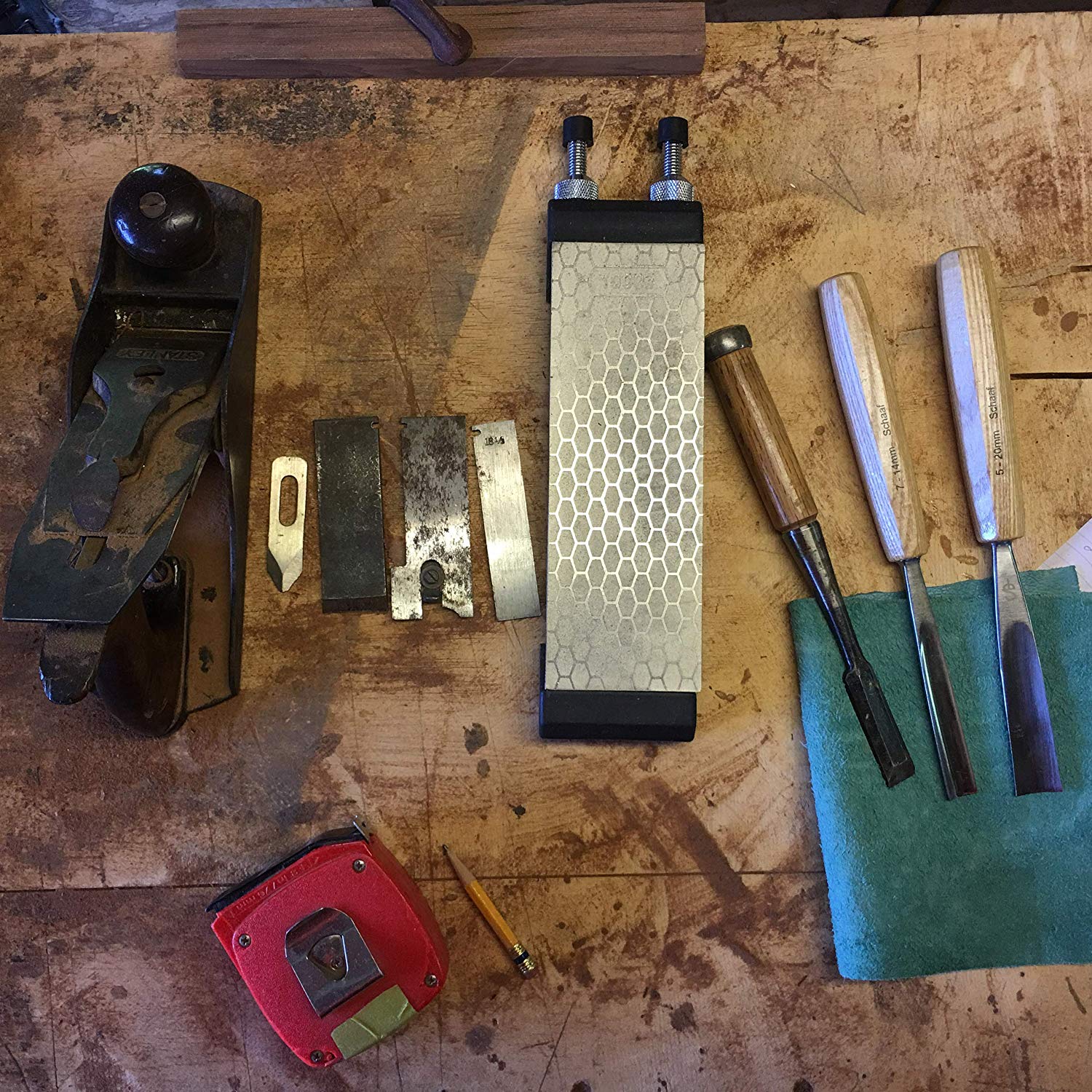 Sharpening stone next to tools